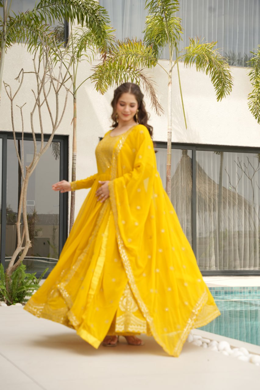 Reception Wear Yellow Color Faux Blooming With Embroidery Zari Sequins Work Designer Gown