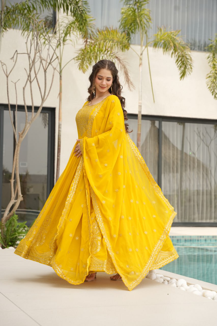 Reception Wear Yellow Color Faux Blooming With Embroidery Zari Sequins Work Designer Gown
