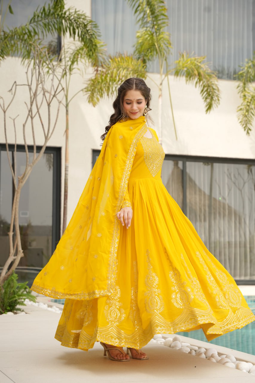 Reception Wear Yellow Color Faux Blooming With Embroidery Zari Sequins Work Designer Gown