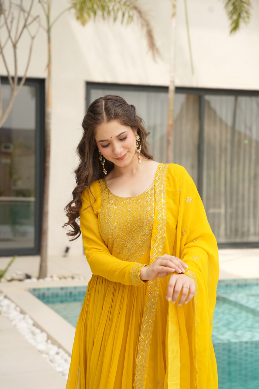 Reception Wear Yellow Color Faux Blooming With Embroidery Zari Sequins Work Designer Gown