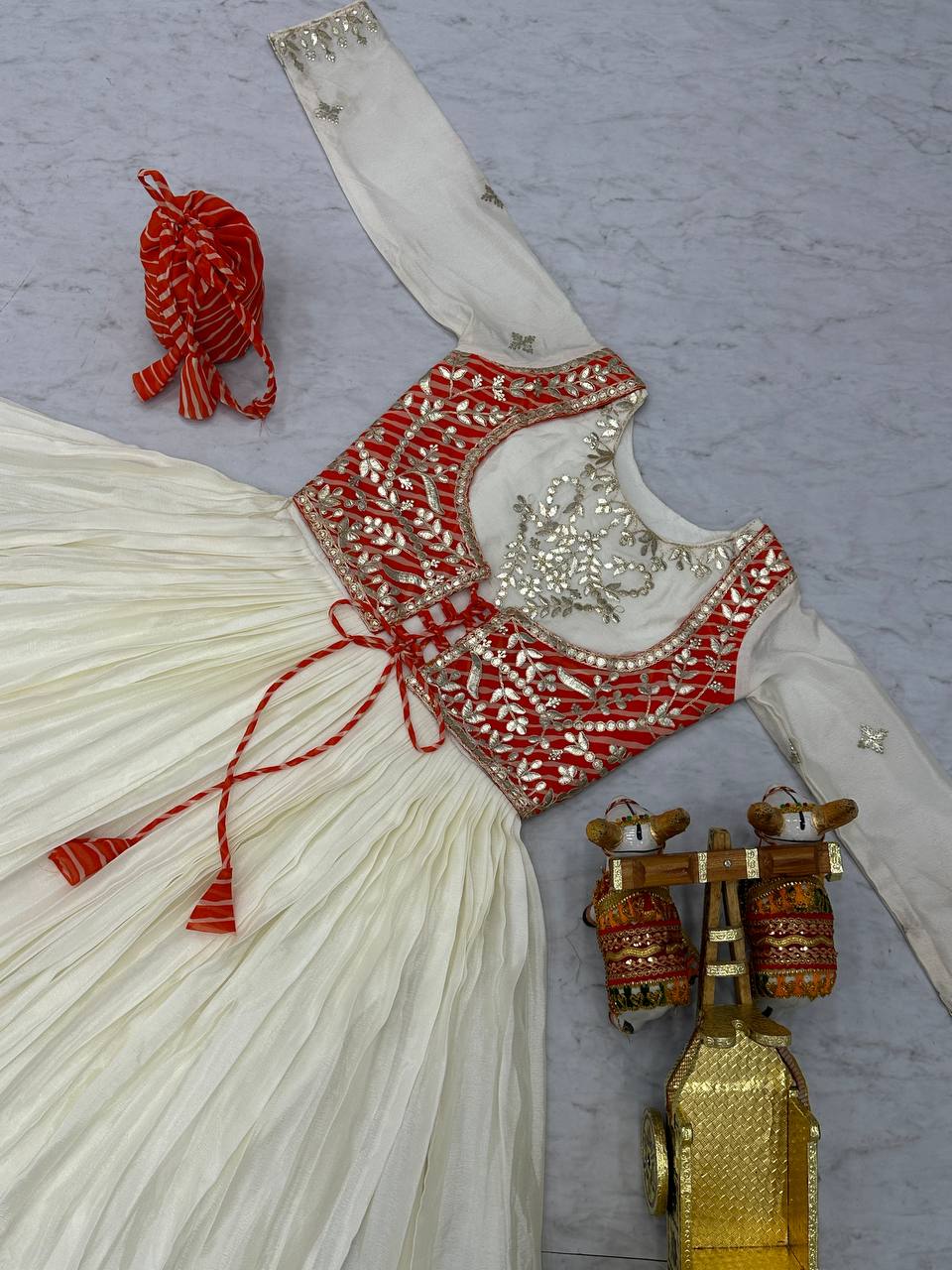 Traditional Wear Off White Color Pure Chinon With Laheriya Printed Beautiful Gown