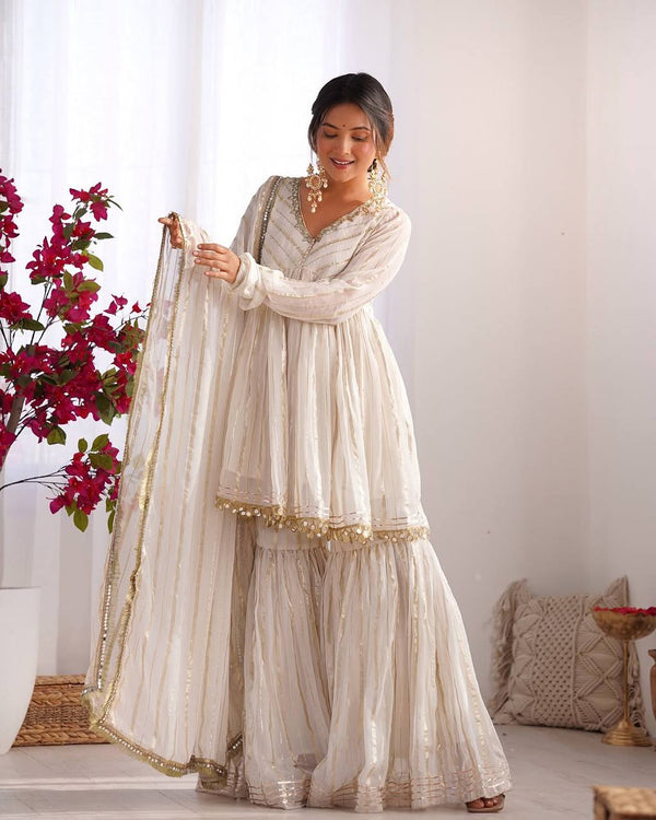 Arti Chauhan's Off White Color Mirror With Handwork Designer Sharara Suit