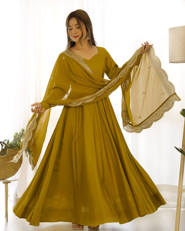 Party Wear Mustard Color Heavy Pure Roman Silk Plain Designer Gown With Work Dupatta