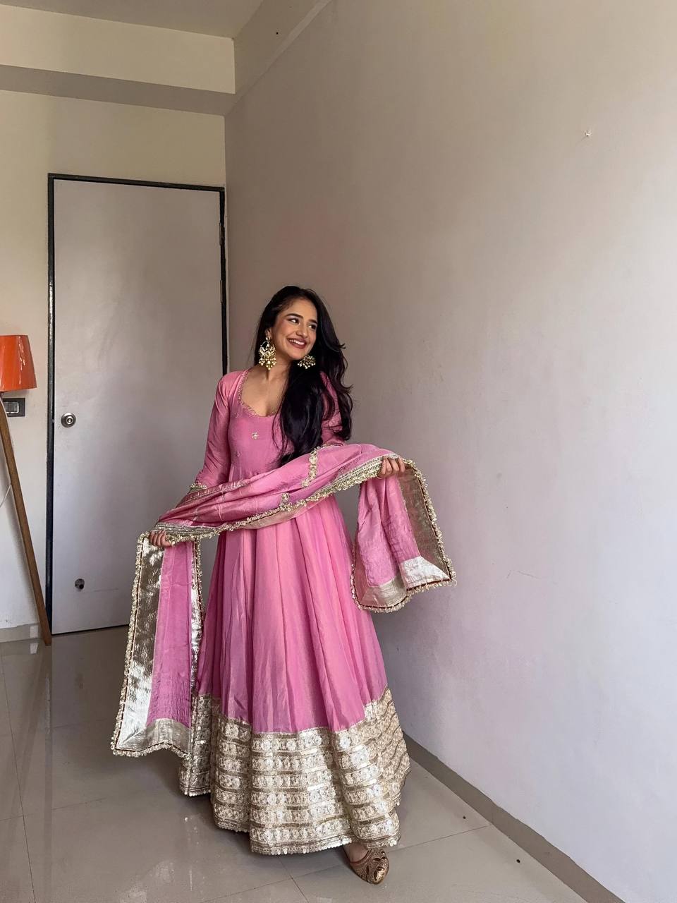 Designer pink Anarkali suit with golden embroidered border and dupatta – women's festive ethnic wear
"Elegant pink Anarkali dress with heavy golden embroidery – ideal Indian outfit for wedding guests"
"Pink embroidered Anarkali suit with dupatta for women"

