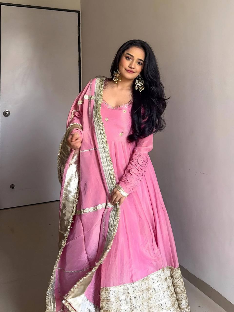 Perfect for weddings, Diwali & special events"

"Beautiful woman in pink Anarkali suit with golden embroidery and matching dupatta – perfect ethnic wear for weddings, festivals, or party occasions."