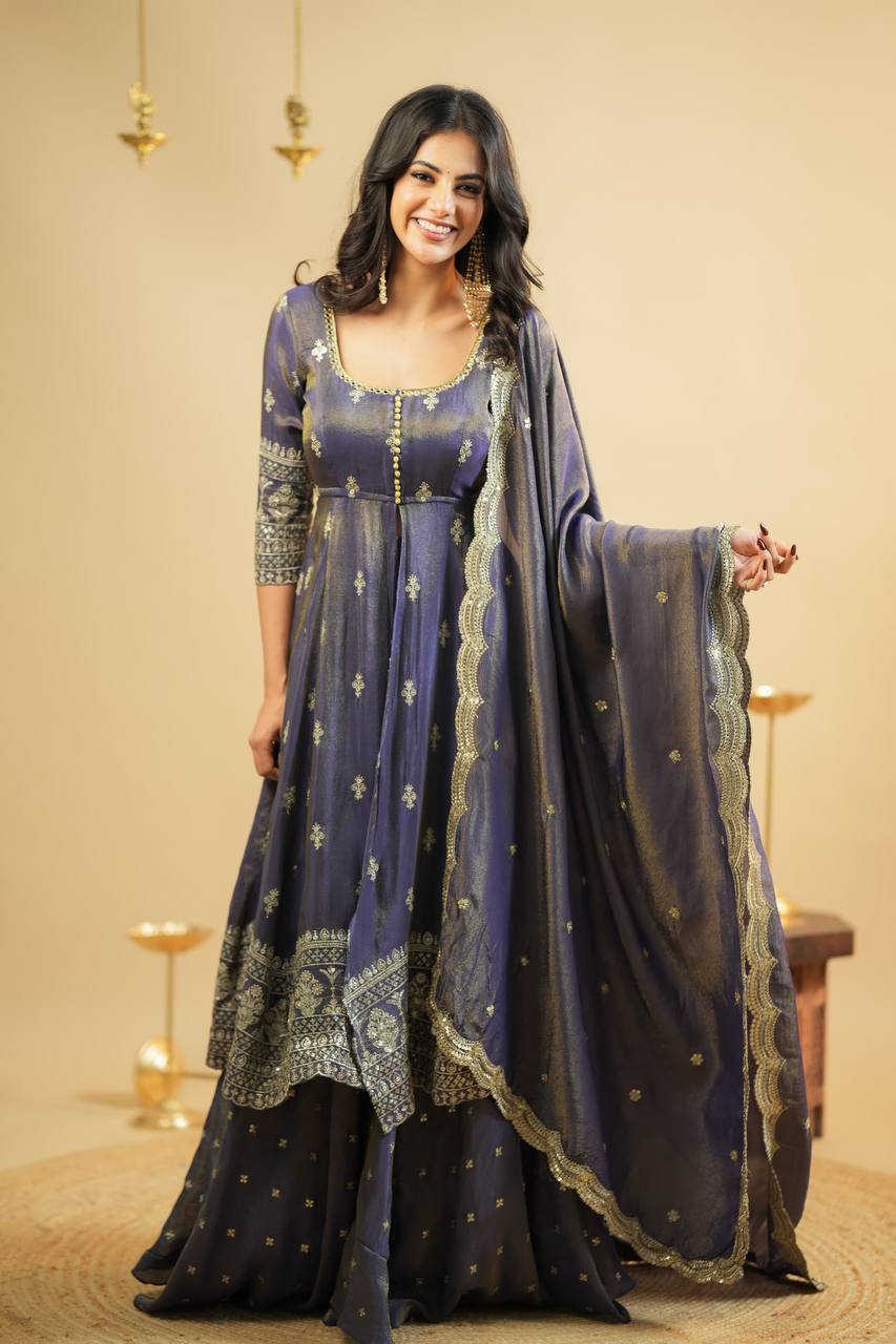 "Beautiful woman wearing a navy blue embroidered Anarkali suit with golden zari work and matching dupatta – ideal festive and ethnic wear for weddings and parties."

"Navy blue Anarkali suit for women with golden embroidery and dupatta – designer Indian festive outfit"

"Elegant navy blue ethnic Anarkali gown with intricate zari embroidery – perfect for wedding and festive occasions"

"Navy blue embroidered Anarkali dress with dupatta for women"


