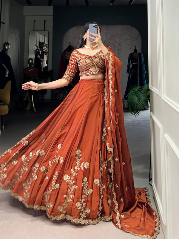Wedding Wear Orange Color Rangoli Silk With Rich Texture Sequins And Thread Embroidery Work Lehenga Choli