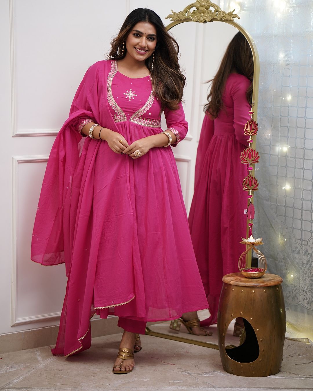 Charming Pink Color Muslin Cotton And Embroidered Work With Flared Kurta Set