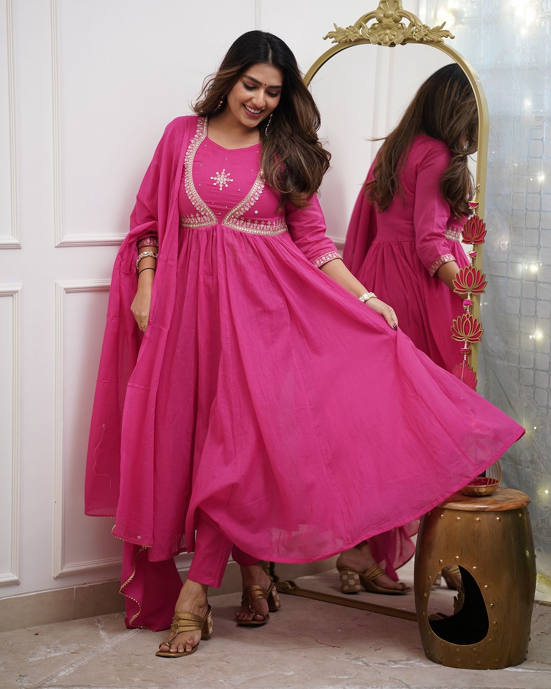 Charming Pink Color Muslin Cotton And Embroidered Work With Flared Kurta Set
