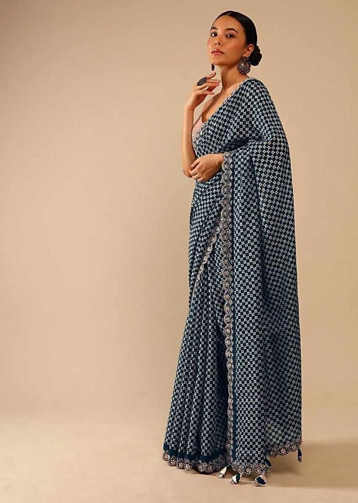 Eyes Catching Print With Border Teal Blue Color Saree