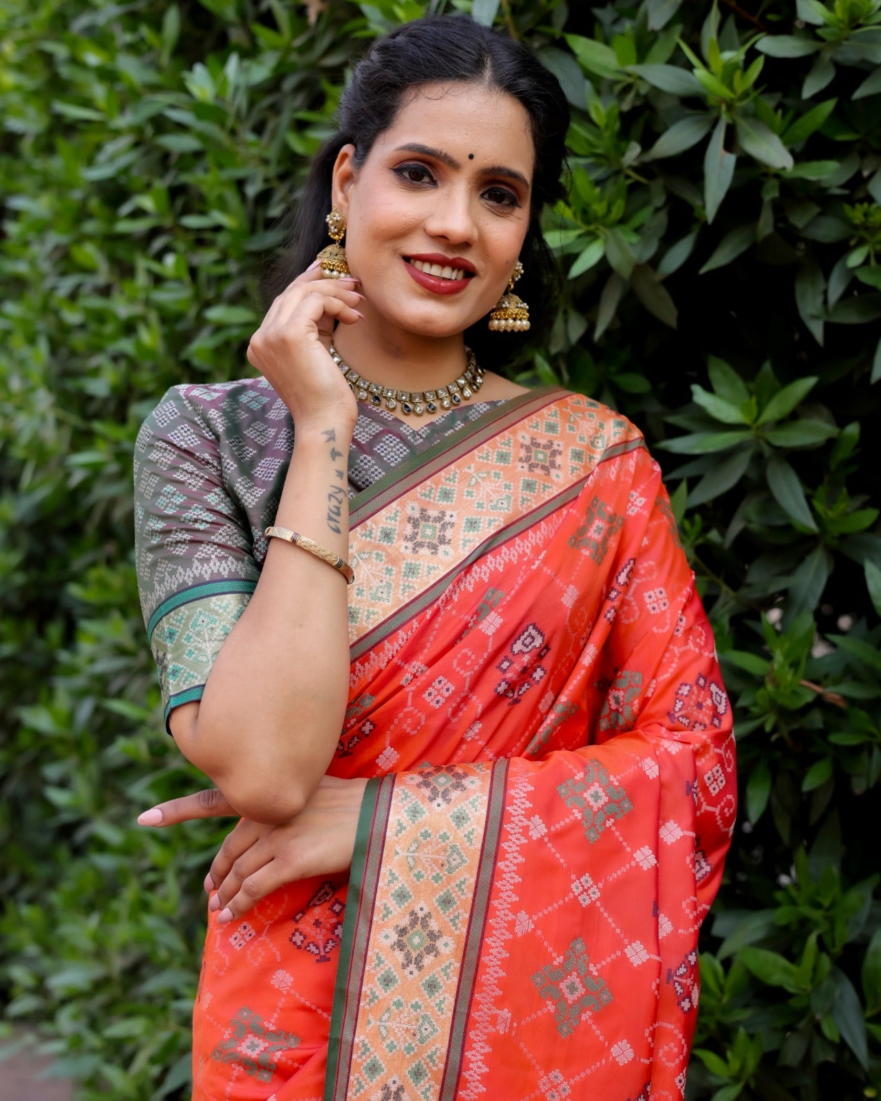 Dazzling Patola Silk Red Color Kanchi Border Saree