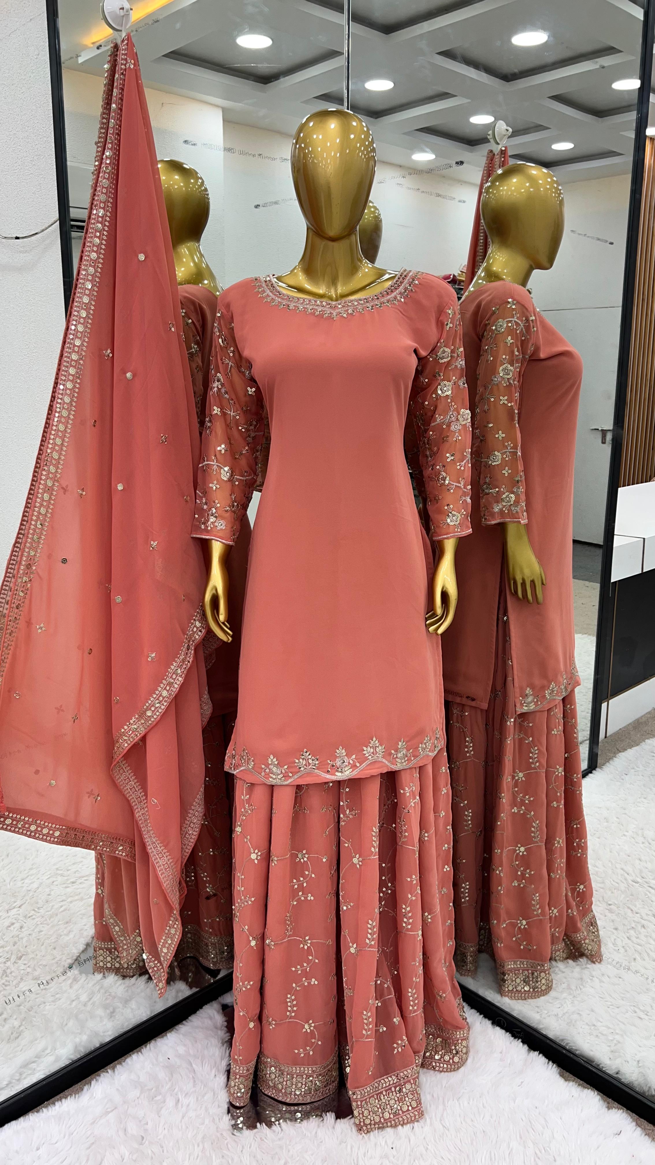 Imposing Embroidery Work Peach Sharara Suit