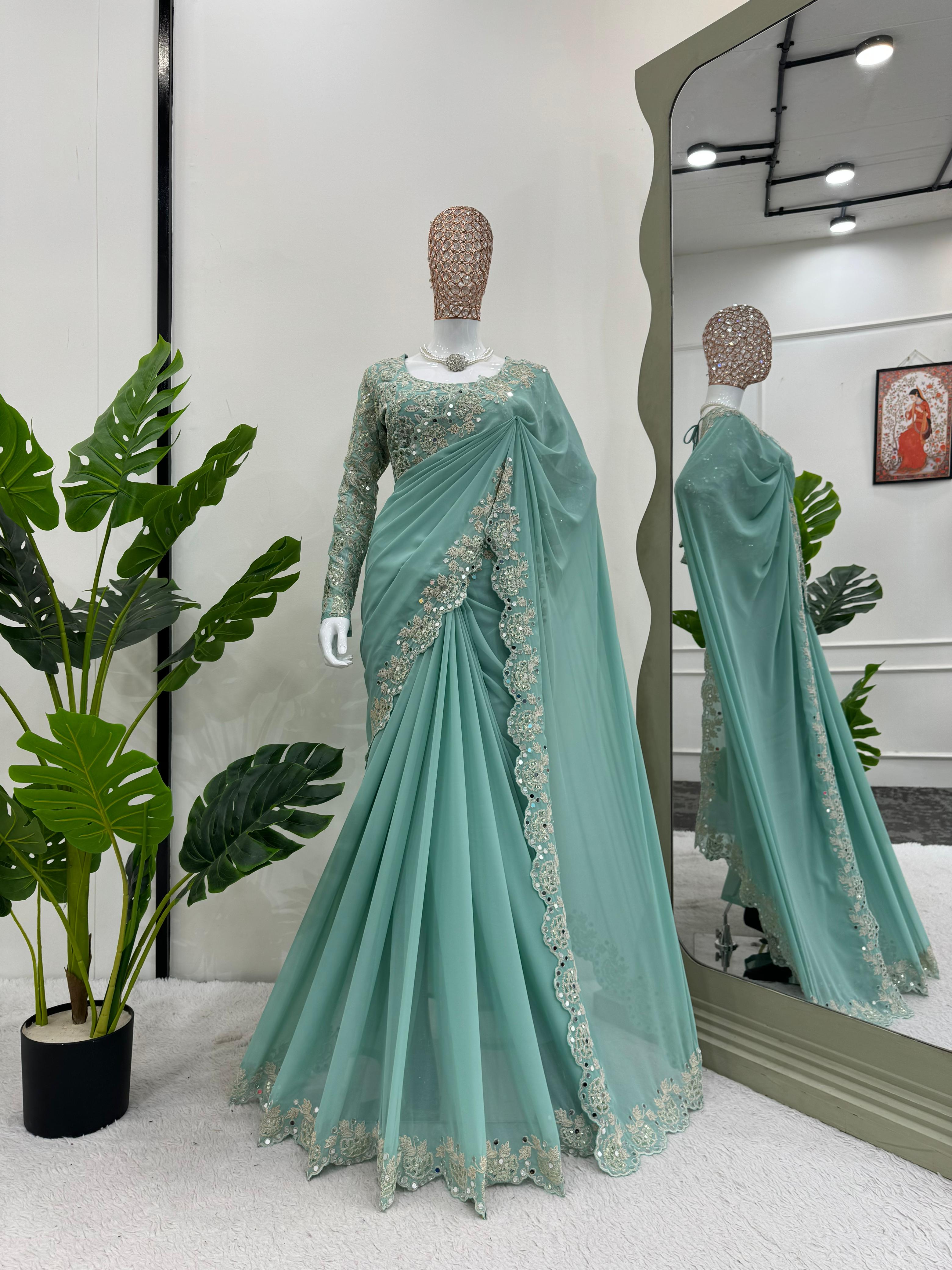 Eyes Catching Sky Blue Faux Georgette Coding And Sequence With Real Mirror Work Designer Saree