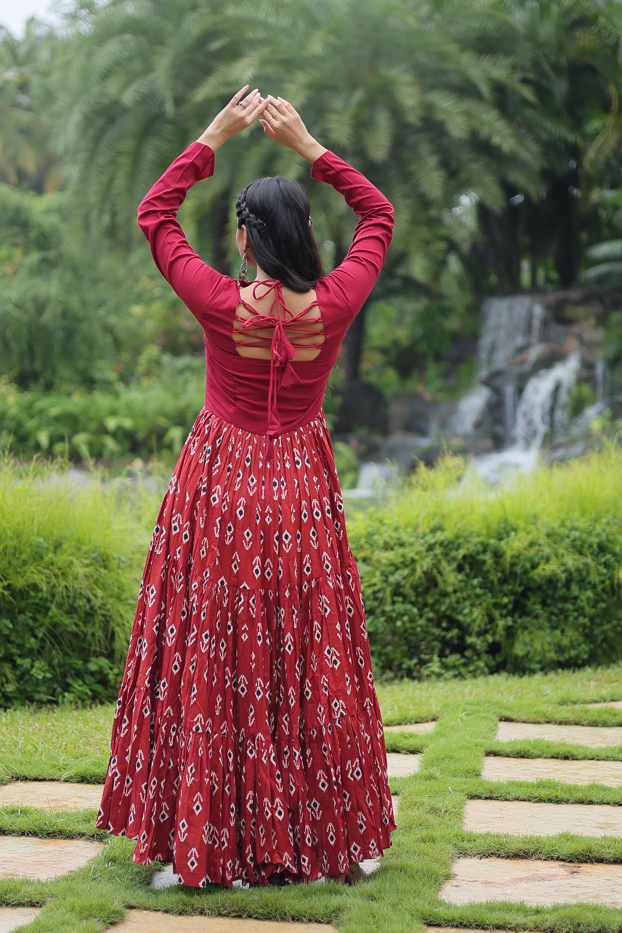 Traditional Wear Printed Cotton With Kutchi Gamthi Work And 12 Meter Flair Maroon Color Navratri Gown