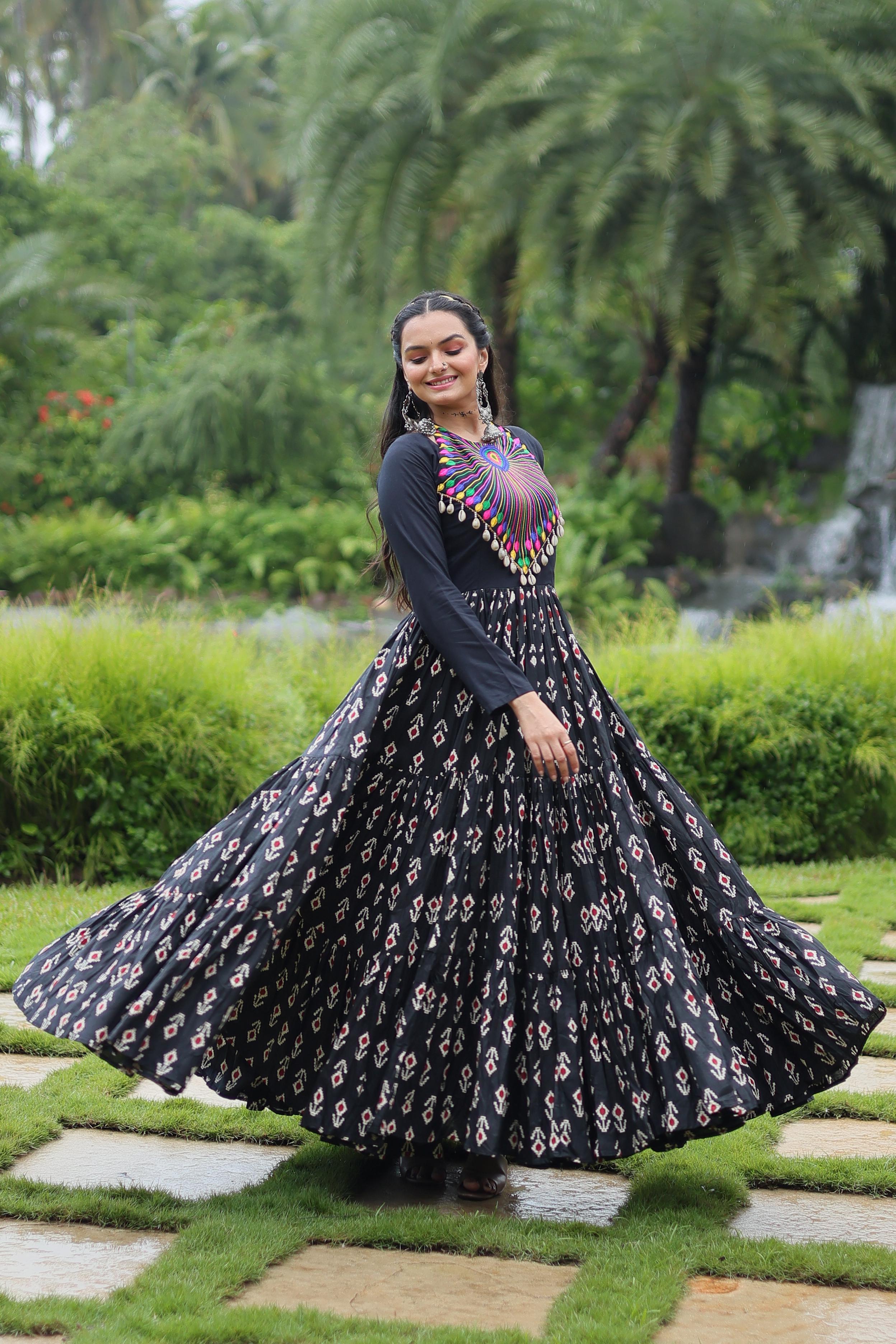 Traditional Wear Printed Cotton With Kutchi Gamthi Work And 12 Meter Flair Black Color Navratri Gown