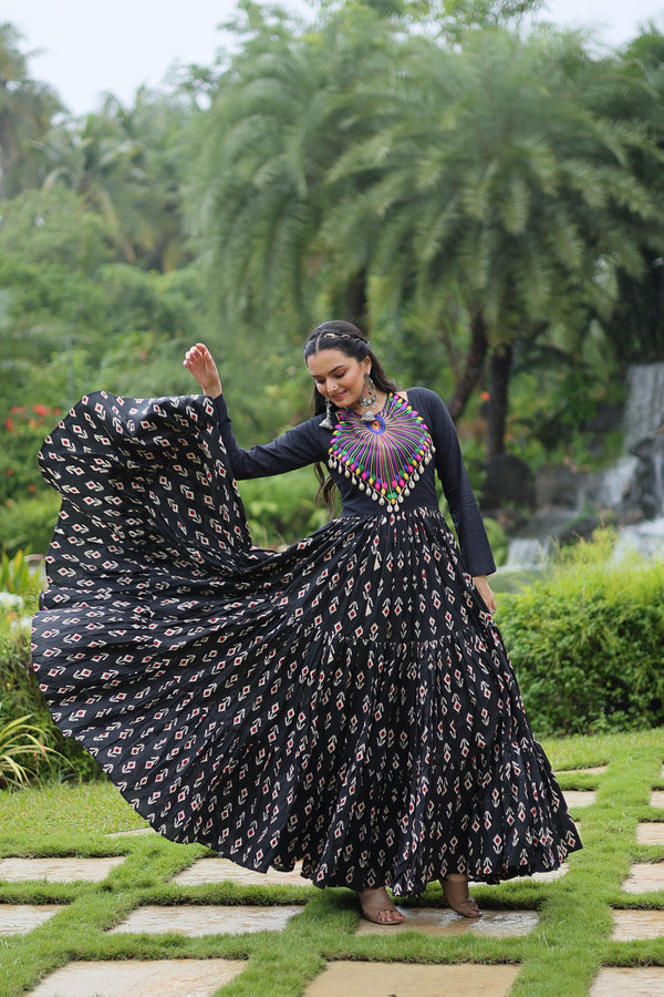 Traditional Wear Printed Cotton With Kutchi Gamthi Work And 12 Meter Flair Black Color Navratri Gown