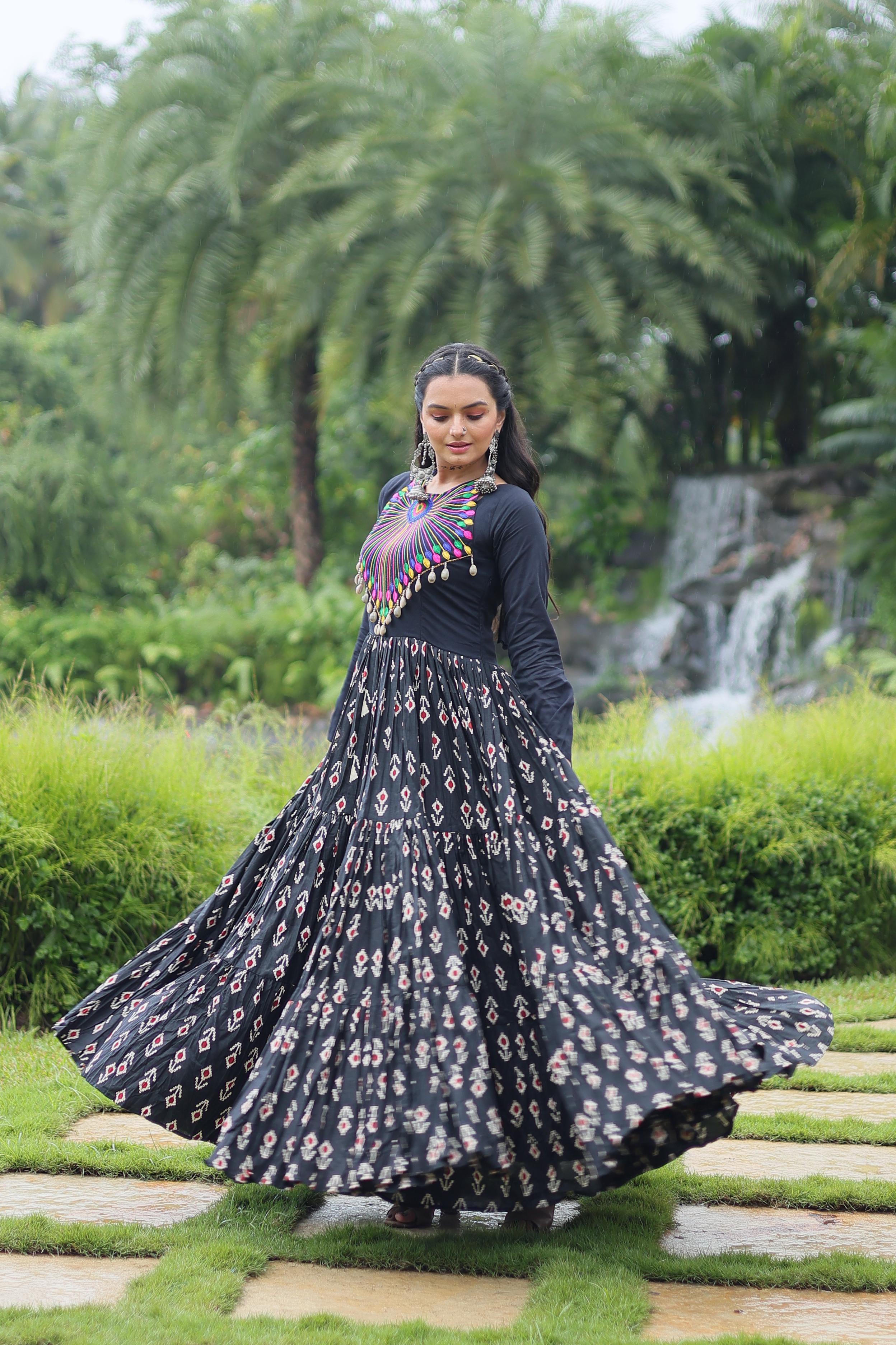 Traditional Wear Printed Cotton With Kutchi Gamthi Work And 12 Meter Flair Black Color Navratri Gown