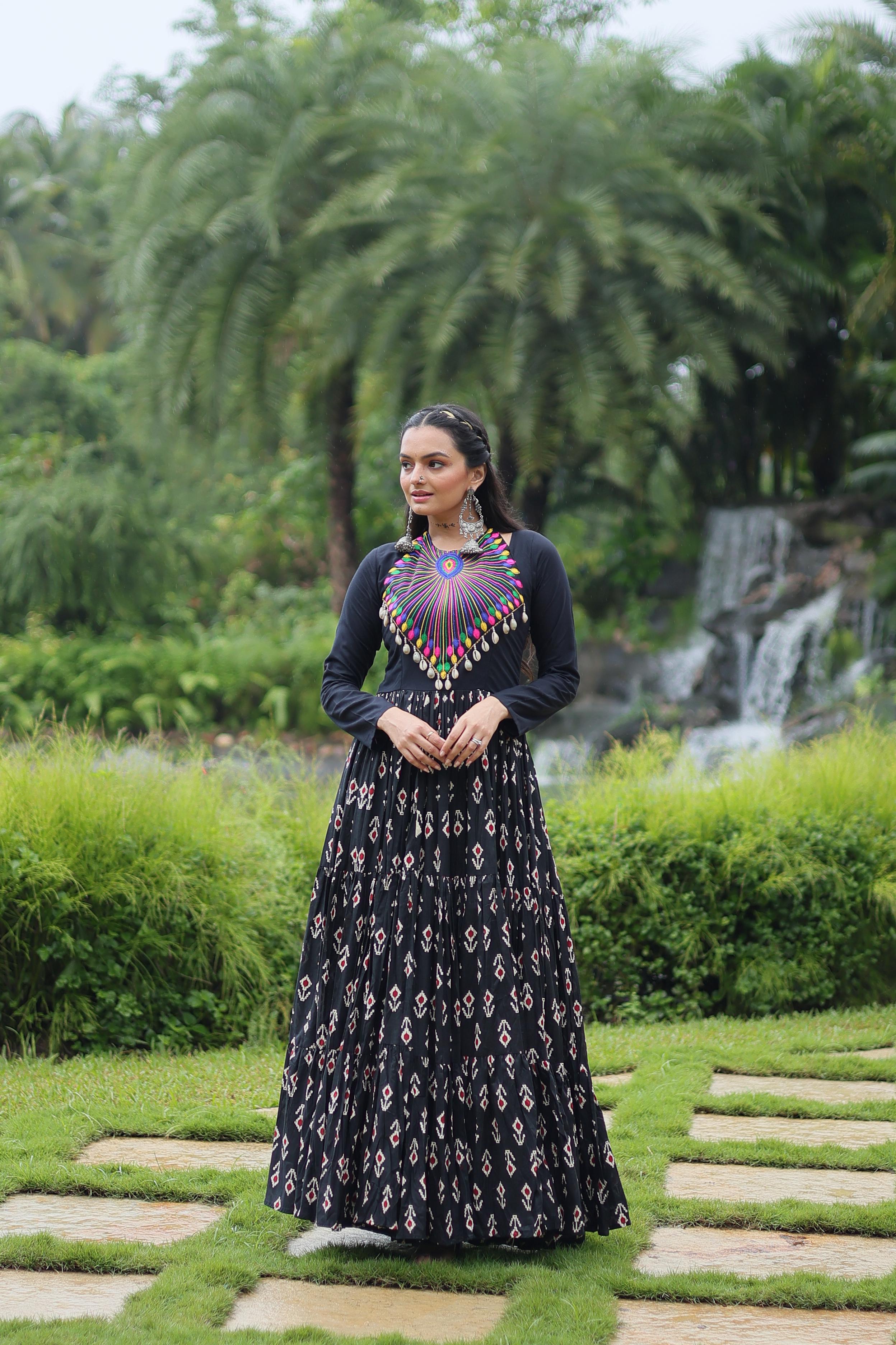 Traditional Wear Printed Cotton With Kutchi Gamthi Work And 12 Meter Flair Black Color Navratri Gown