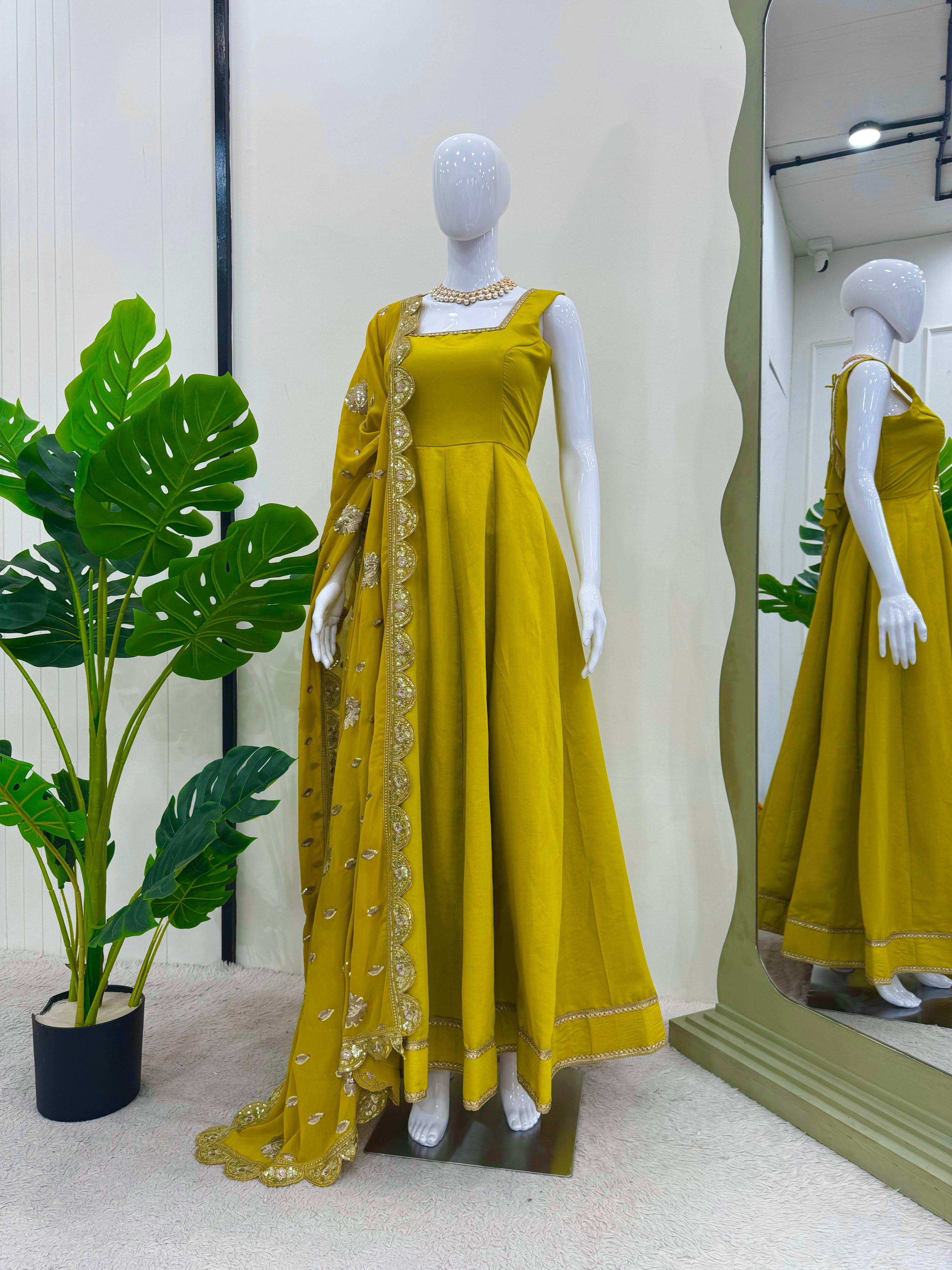 Glimmering Mustard Color Heavy Roman Silk With Fancy Lace Designer Gown