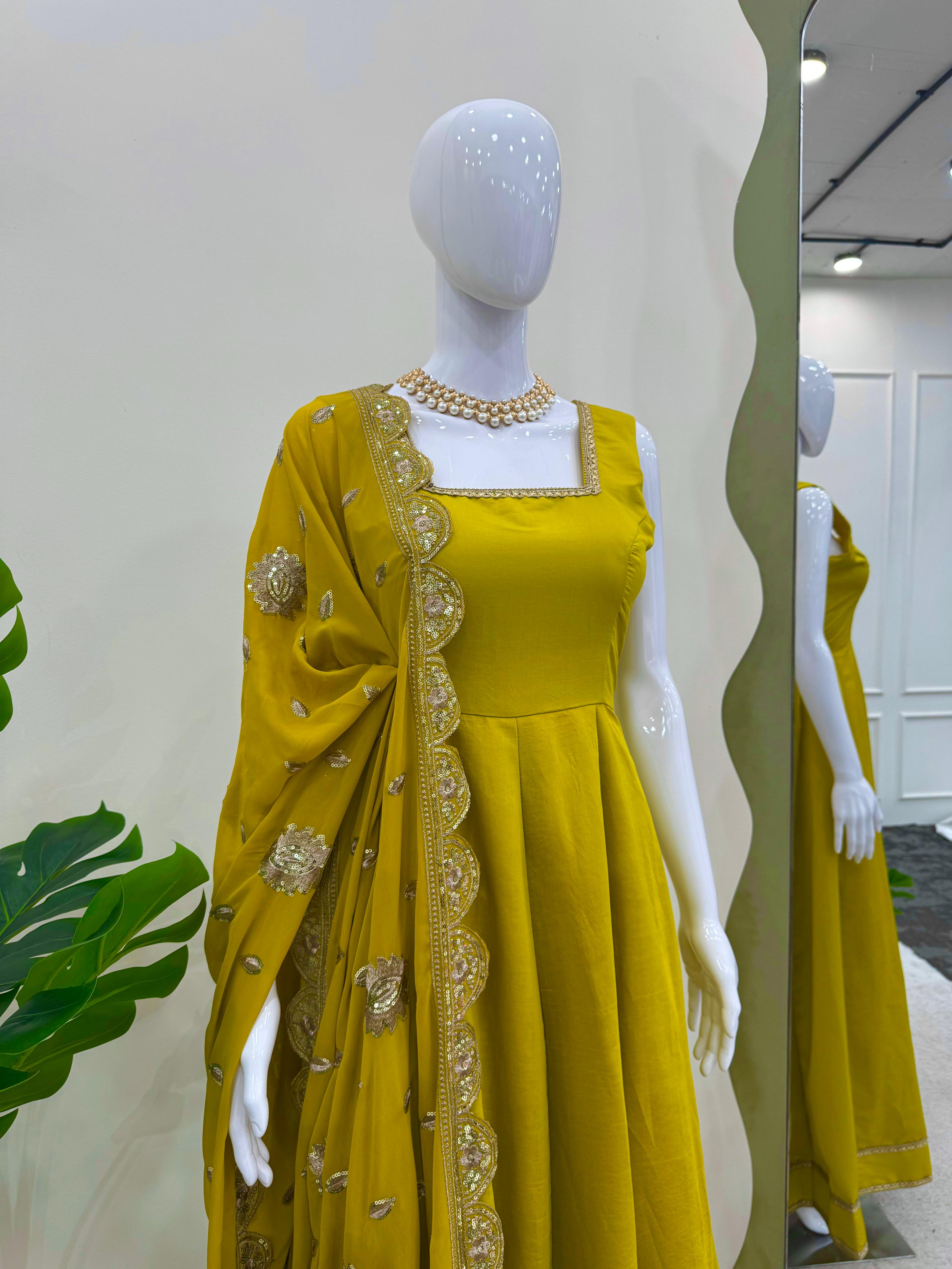 Glimmering Mustard Color Heavy Roman Silk With Fancy Lace Designer Gown