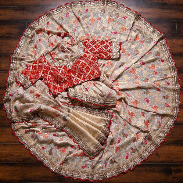 Classy Off White Saree With Red Bandhani Blouse