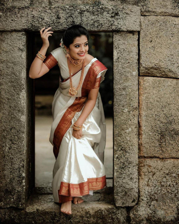 Opulent White Color Soft Lichi Silk Golden Zari Saree