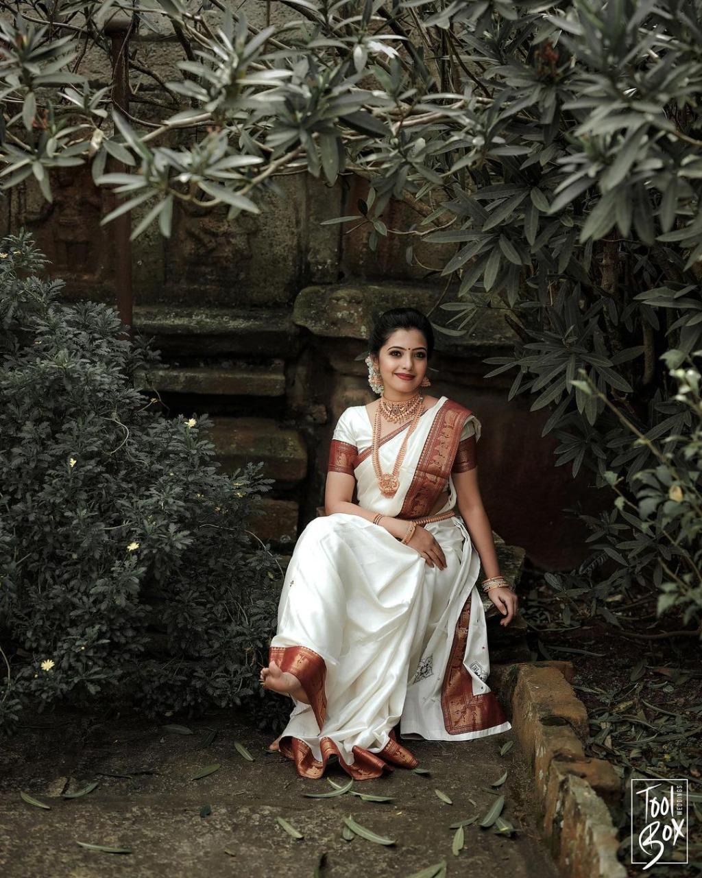 Opulent White Color Soft Lichi Silk Golden Zari Saree